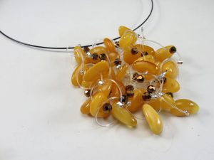 A black necklace with amber beads