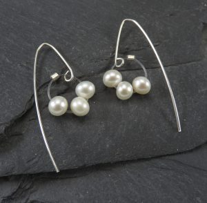 A pair of pearl earrings
