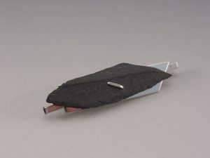 A black cloth over a silver plate