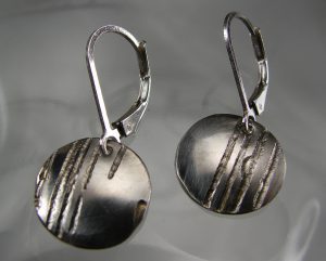 A pair of silver earrings