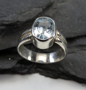 A silver band with a crystal