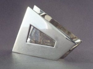 Two silver plates covering a crystal