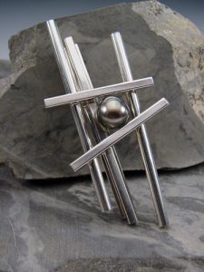 A metal bead surrounded by rods