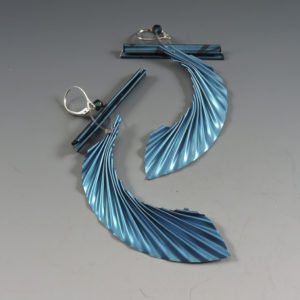A pair of metallic blue earrings